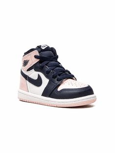 the air jordan 1 mid sneaker in white and blue is shown with pink accents