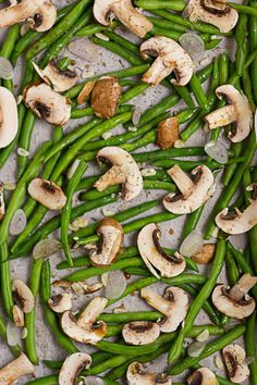 green beans and mushrooms on a baking sheet