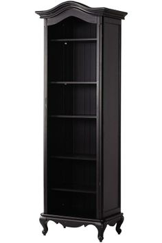 a tall black bookcase sitting on top of a white floor