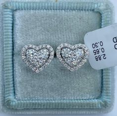 Stunning Heart Diamond Stud Earrings.  Excellent craftsmanship, the diamonds are bright and very sparkling.  The center diamonds are nice size, all set smooth.  The shape is very pretty.  Nice and solid backings for a secure fit.  These diamond studs are simply classy and beautiful.  Heart measures 10.5x9.1mm.  Genuine Diamonds total weight: 0.93 Carats  Clarity: VS/SI1 Color: F All white and shiny diamonds, no cloudy or yellowish stones  18K white gold 2.88 grams  Comes with gift box * We have been in the wholesale Jewelry business for over 30 years serving the community at the same location. All diamonds we use are natural stones and fine quality gold. Absolutely NO clarity enhanced or treated diamonds. Our jewelry pieces are handcrafted with fine craftsmanship and good quality stones. O White Diamond Heart-cut Earrings, Luxury Heart-shaped Diamond Cut Earrings, White Diamond Heart Cut Earrings, Heart Shape Diamond Earrings, Gia Certified Heart-shaped Diamond Jewelry, Diamond White Heart Cut Brilliant Earrings, Diamond White Brilliant And Heart Cut Earrings, White Diamond Heart-shaped Earrings, Fine Jewelry Heart Cut Diamond White Earrings