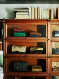 a book shelf with many books and other items on it