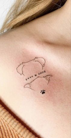 a woman with a tattoo on her chest that says, this is dog's best friend