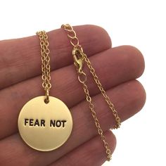 "Silver or Gold Fear Not necklace with card \"Fear Not I am with thee... Choose Gold Disc stamped with hand painted black lettering or Silver natural color. Matte Finish J E W E L R Y ∙ D E T A I L S * MATERIAL: Brass dipped in silver or gold * CHARM SIZE: 3/4\" diameter * CHAIN LENGTH: 15-17\" adjustable cable chain * CRAFTED WITH LOVE P R O C E S S I N G ∙ T I M E We work hard to prepare and ship all orders within 1 - 2 business days. S H I P P I N G ∙ T I M E ★ Free Domestic Shipping on quali Sister Missionary Gifts, Bible Verse Necklace, Scripture Jewelry, Missionary Gifts, Necklace Christian, Graduation Gifts For Daughter, Hope Gifts, Encouragement Gift, Encouragement Gifts