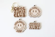 three wooden badges with the words good news club and some sort of smile on them