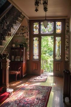 the sun shines through an open window into a room with wooden floors and stairs