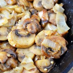 mushrooms and onions cooking in a skillet