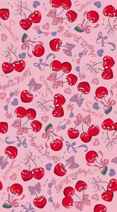 a pink background with red cherries and hearts on it's side, all over the surface