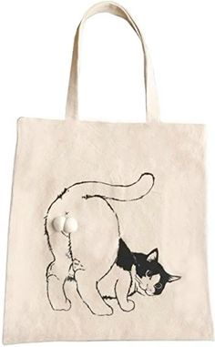 a white bag with a black and white cat on it