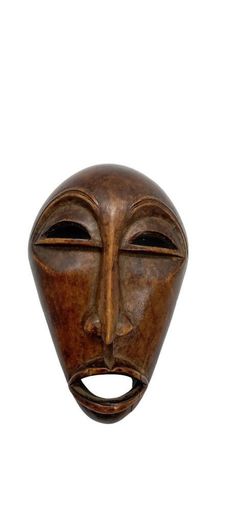 a wooden mask on a white background