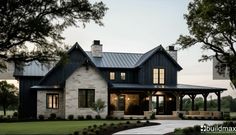 a large house with lots of windows in the front yard