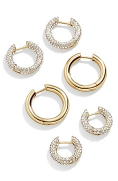 Enjoy three ways to sparkle and shine with this trio of huggie-hoop earrings in gleaming goldtone plating and rows of glistening crystals. Includes three pairs huggie hoop earrings 1/2"-3/8" hoop diameter; 1/8" width Hinges with snap-post closures Goldtone plate/glass/cubic zirconia Imported Preppy Jewelry, Ups Shipping, 18k Gold Earrings, Jewelry Accessories Ideas, Dope Jewelry, Jewelry Essentials, Jewelry Lookbook, Earrings In Gold, Huggie Hoop Earrings