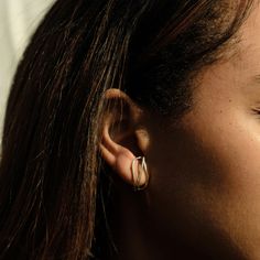 a close up of a person with ear piercings