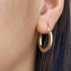 These 18k Gold Filled Flat Hoop Earrings offer a fun and classic look with a unique twist. Crafted from high-quality materials, these earrings provide a luxurious feel that will last. With its sleek design, these earrings will have you turning heads. * Metal: 18k gold-filled * Size: 25mm diameter x 4mm wide x 2mm thick  * Hypoallergenic * Waterproof * Made in Brazil Jewelry makes the perfect gift for any occasion, especially for her on Christmas, Mother's Day, Valentine's Day, or her birthday. Flat Hoop Earrings, Restoration Hardware Style, Fox Jewelry, Pearl Rosary, Rosary Bracelet, Birthstone Charms, Cleaning Clothes, Precious Metals, Sleek Design