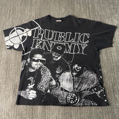 Vintage 90s Public Enemy All Over Print Hip Hop Rap Music 1990s Fashion Single Stitch Made in USA Black Graphic T Shirt Extra Large Mens Condition:  Fair Used Condition  = Shirt smells like smoke Measurements: Please see photos above for all measurements IF YOU BUY TWO OR MORE ITEMS USE THE CODE BUNDLE @ CHECK TO SAVE 20% WE SHIP WITHIN 24 HOURS AFTER PURCHASE! Please be aware that we do not offer free returns!! The Buyer is responsible for the cost of the return label.  Follow us on TikTok & In Graphic Shirts Aesthetic, Straight Out Of Compton, Bandit Aesthetic, Mens Graphic Tees Prints, Rap Clothes, Rap T Shirt, Ruff Ryders, Acid Bath, Vintage Shirt Design