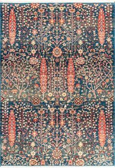 an antique rug with blue and red colors