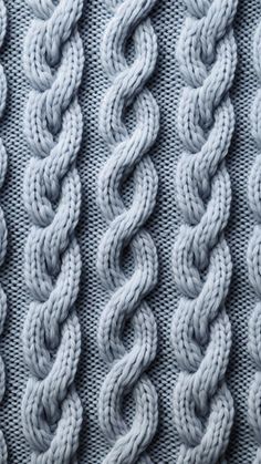 the texture of knitted material is shown in shades of blue and grey, with wavy lines