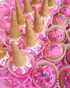 cupcakes with pink frosting and sprinkles on them