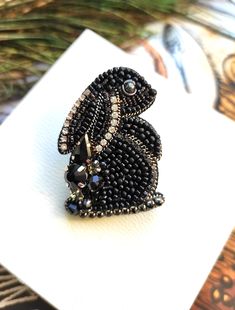 Beautiful and impressive, handcrafted rabbit brooch.This embroidered jewelry will perfectly complement your jewelry collection or will be a wonderful gift to a very special person.Handembroidered rabbit with glass beads, chrystal's, Czech beads, metal thread. Looks very beautiful.– – – – – – – – – – – – – – – – – – – – – – – – – – – – – – – – – – – – – – – – – – – – – – – – –If you can't find exactly what you want, please contact me and I will make unique, one of a kind jewelry based on your wis Insect Jewelry Diy, Beaded Penguin, Beaded Rabbit, Embroidery Rabbit, Beaded Pins, Rabbit Brooch, Rabbit Jewelry, Beaded Flowers Patterns, Beaded Brooches