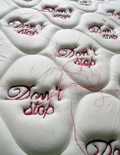 there are many pillows with writing on them that say don't stop and do not stop