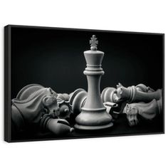 a black and white photo of chess pieces