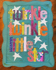 a quilted wall hanging with the words twinkle, winke and make me smile