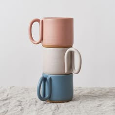 three mugs stacked on top of each other