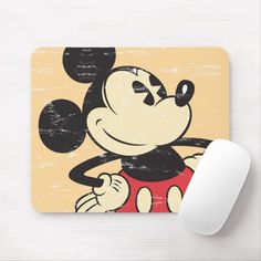 a mouse pad with a cartoon mickey mouse on it