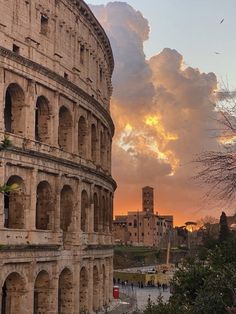 the roman colossion at sunset with clouds in the background