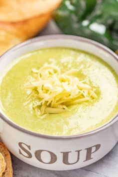 a bowl of soup with bread on the side