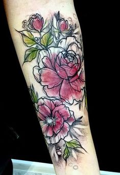 a woman's arm with flowers on it