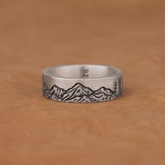 Mountains and Pine Trees Forest Art Ring Silver Ring, Minimalist 925 Sterling Silver Oxidized Engagement Ring, Nature Inspired Jewelry Gifts Made of 925 silver and handcrafted by hand, this ring is not only an accessory piece that complements your daily elegance, but also has details that will reflect your character and style. It is also a great gift to give to your loved ones on their special days. At SavisSilver, we always give importance to the satisfaction of our customers, we recommend you Minimalist Stamped Rings As Gifts, Stamped Sterling Silver Open Ring, Minimalist Stamped Rings For Gifts, Nature-inspired Sterling Silver Ring Stamped 925, Minimalist Stamped Jewelry For Promise Ring, Stamped Sterling Silver Open Ring Jewelry, Minimalist Stamped Promise Ring, Nature-inspired Sterling Silver Ring, Minimalist Nickel-free Engraved Ring