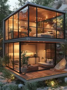 a house built into the side of a cliff with glass walls and lots of windows