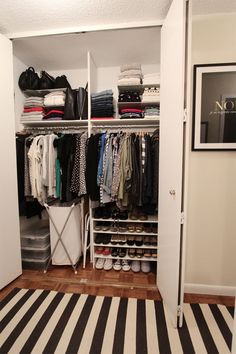 an organized closet with clothes and shoes