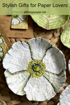 some paper flowers are sitting in a basket