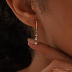 Crystal Huggie Earrings, Diamond Huggie Hoops, Tassel Diamond Earrings, Dangle Drop Earrings, Everyday Wear Earrings, Bridesmaid Gift for Her ❤ WHY YOU'LL LOVE IT * Exceptional Craftsmanship: Beautifully designed and built to last. * Meticulous Attention to Detail * Hypoallergenic, Nickel-Free & Safe for Sensitive Skin ❤ WHAT YOU'LL GET * A Heartfelt Product: A beautifully crafted item designed to captivate. * Packaged with ♡: Presented in a pretty little box, READY for GIFTING. * Finish: 18K Go Dangle Diamond Earrings, Diamond Huggie Earrings, Earrings Everyday, Earrings Bridesmaid, Earrings Diamond, Earrings Studs, Wedding Idea, Huggie Earrings, Bridesmaid Earrings