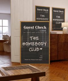 two signs on the wall in a room with wooden floors and white walls, one has a message that reads guest check the somebody club