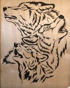 two wolfs are facing each other with their heads turned to the opposite direction, in black and white