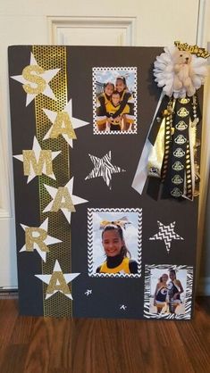 a black and white photo frame with gold foil stars on it, hanging from the side of a door