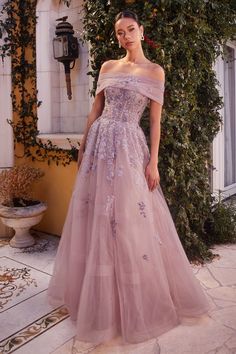 This Andrea And Leo -A1348 Floral Off Shoulder Ball Gown is the perfect combination of elegance and femininity. With a stunning off-shoulder design and a beautiful floral print, this ball gown will make you stand out at any special occasion. Made with high-quality materials, it will ensure a comfortable and flattering fit all night long. Don't miss out on this exquisite piece.