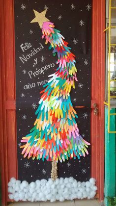 a christmas tree made out of colored paper