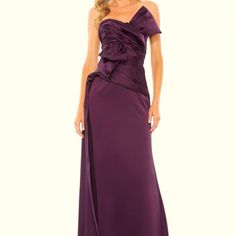 a woman in a long purple dress