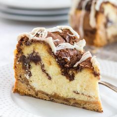 a piece of cake sitting on top of a white plate with a fork in it