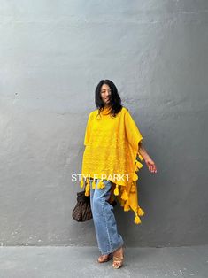 This is a warm knit poncho that is very light and stylish even if you just put on it lightly. It's a stylish product with any style such as leggings or jeans. The sleeves are open-style. ❤️Please see the professional model of Stylepark1 Her body size is medium size And Tall 174cm 5.72FT for the American size. Please look at the fit style of the model.❤️ Size - One size ( one size all fit) Width: 110cm /43.30inch Length - Back  (with tassel) 105cm /41.33inch/3.44ft Front - with tassel 70cm/27.55i Casual One Size Poncho With Fringe, Casual One-size Poncho With Fringe, One Size Tassel Poncho For Spring, One Size Spring Poncho With Tassels, Summer Poncho With Fringe, Spring Poncho One Size With Tassels, Spring Poncho With Tassels One Size, Spring Poncho With Tassels, Summer Long Sleeve Poncho With Fringe