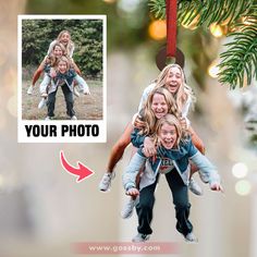 an ornament hanging from a christmas tree with two girls and one boy on it