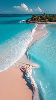 an aerial view of the ocean and beach with waves coming in from the water,