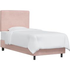 a bed with a pink headboard and white sheets