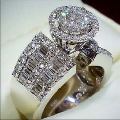 two diamond rings sitting on top of each other