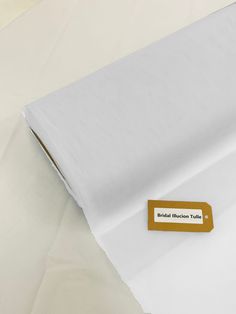 a white bed sheet with a label on it