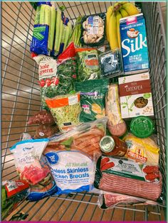 a shopping cart filled with lots of food