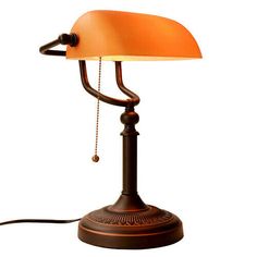 an old fashioned desk lamp on a white background